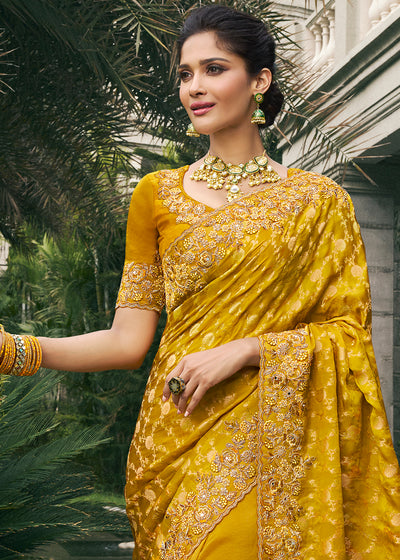 Mustard Color Tissue Silk Embroidered with Golden Stone Floral Heavy Border Saree