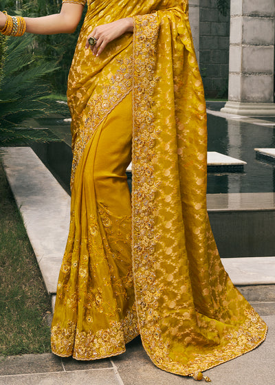 Mustard Color Tissue Silk Embroidered with Golden Stone Floral Heavy Border Saree