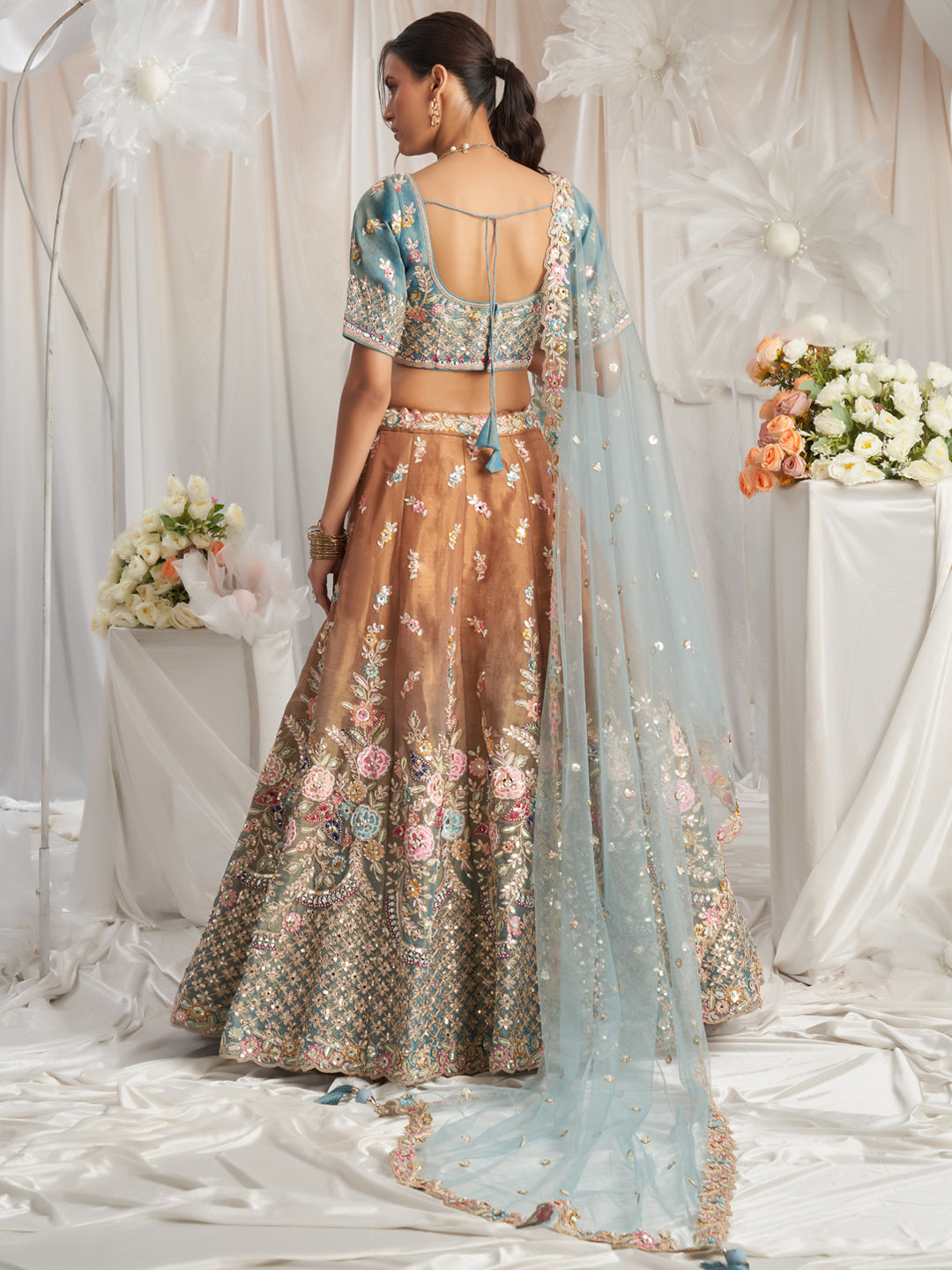 Brown-Turquoise Blue Color Bridal Net Embroidered Gotta Patti Work Using Golden Sequins,Mirror and Multi-Thread Semi-Stitched Lehenga